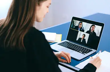 Office worker engaging in a video call on their laptop 
